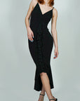 Model is wearing Black Ruffle Front Wrap and Hem Maxi Dress She's Elegant