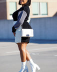 Model is wearing Color Block Knit Sweater Dress She's Elegant