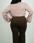 Model is wearing Long sleeve taupe chiffon body suit She's Elegant