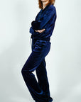 Model is wearing Navy Blue Velvet Flared Pants and Jacket Track Suit Set Navy Blue Velvet Flared Track Suit Jacket/Pants Set She's Elegant