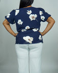 Model is wearing Navy Floral Printed Top with Puff sleeves She's Elegant