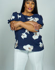 Model is wearing Navy Floral Printed Top with Puff sleeves She's Elegant