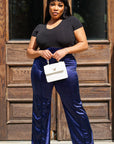 Model is wearing Navy Satin Stretchy Highwasted pants She's Elegant