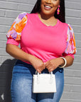 Model is wearing Pink- Floral Printed Detailed- Puff Sleeve Top She's Elegant