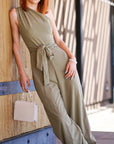 Model is wearing Sage One Shoulder Jumpsuit With Selftie Belt Sage One Shoulder Jumpsuit With Self tie Belt She's Elegant