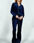 Model is wearing Velvet Flared Track Suit Jacket/Pants Set Navy Blue Velvet Flared Track Suit Jacket/Pants Set She's Elegant