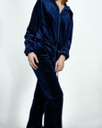 Model is wearing Velvet Flared Track Suit Jacket/Pants Set Navy Blue Velvet Flared Track Suit Jacket/Pants Set She's Elegant