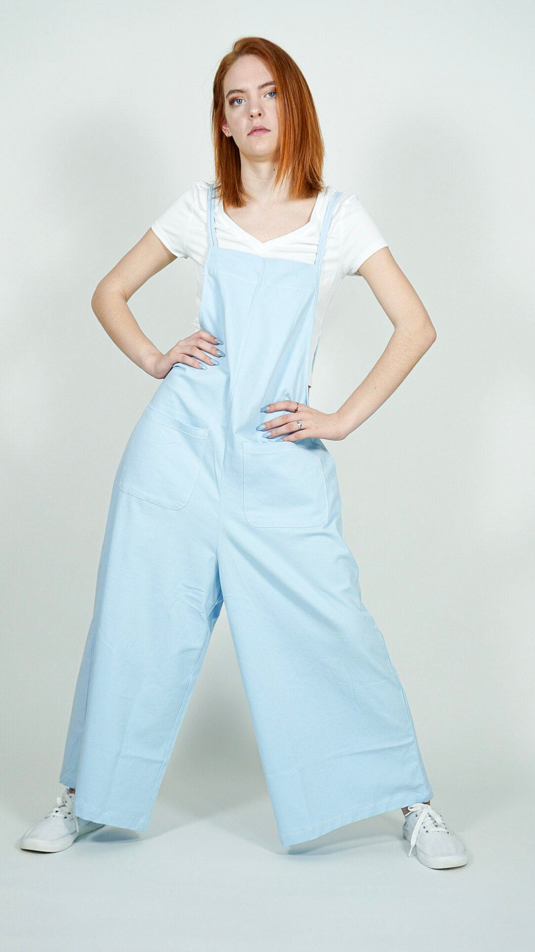 Model is wearing Baby Blue Wide Leg Jumpsuit. With Pockets She's Elegant 