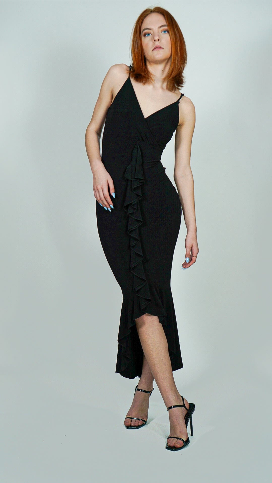 Model is wearing Black Ruffle Front Wrap and Hem Maxi Dress She&#39;s Elegant