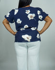 Model is wearing Navy Floral Printed Top with Puff sleeves She's Elegant 